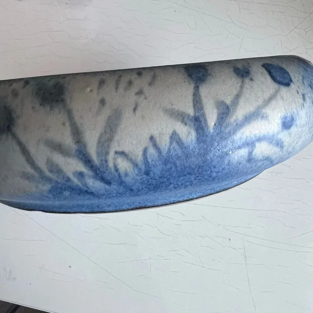 North Eagle Pottery hand-thrown and features a matte or glazed finish in blue an